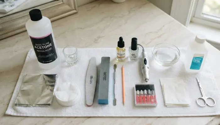 Gathered supplies for removing acrylic and gel nail extensions at home Gathered supplies for removing acrylic and gel nail extensions at home
