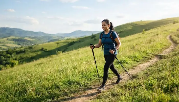Person doing incline walking on an outdoor trail to boost weight loss Person doing incline walking on an outdoor trail to boost weight loss