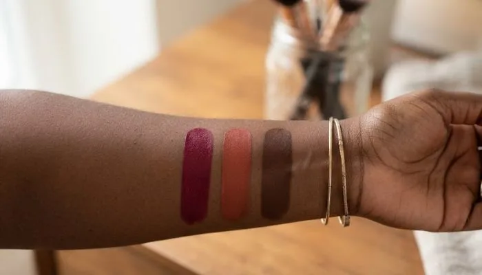 Arm swatches of warm lipstick shades including deep berries, terracottas, and warm browns suitable for dark and pigmented lips. Arm swatches of warm lipstick shades including deep berries, terracottas, and warm browns suitable for dark and pigmented lips.