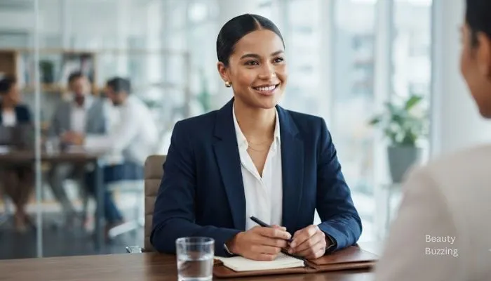 Confident woman with a sleek middle-part low bun ideal for a job interview